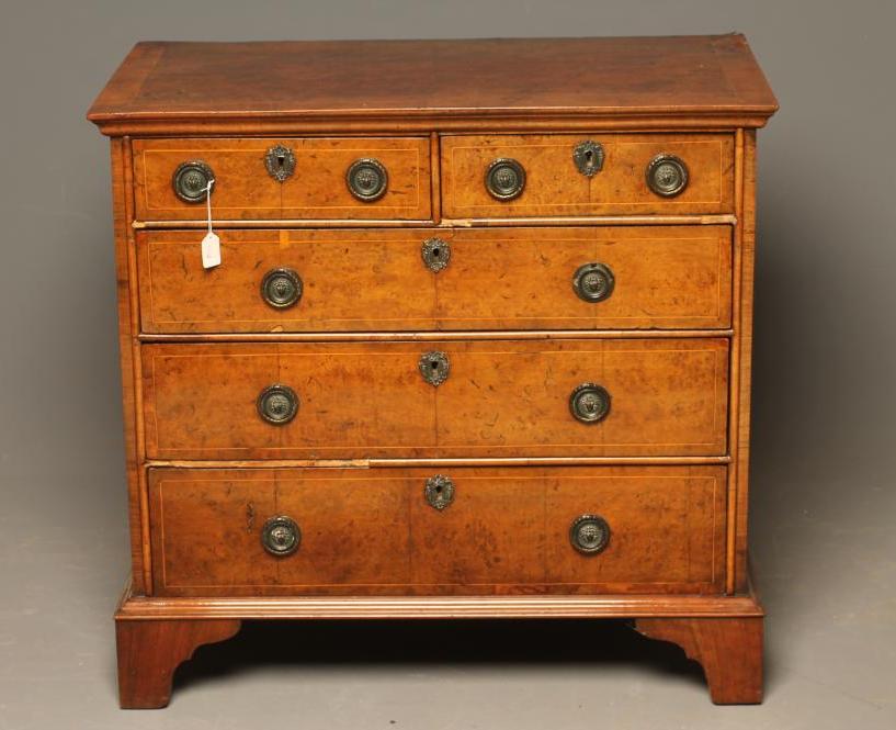 AN EARLY GEORGIAN WALNUT CHEST Image