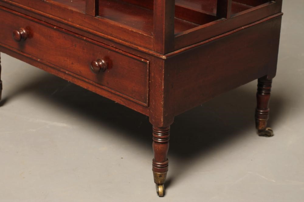 A REGENCY MAHOGANY CANTERBURY of oblong dished form with three slatted divisions Image