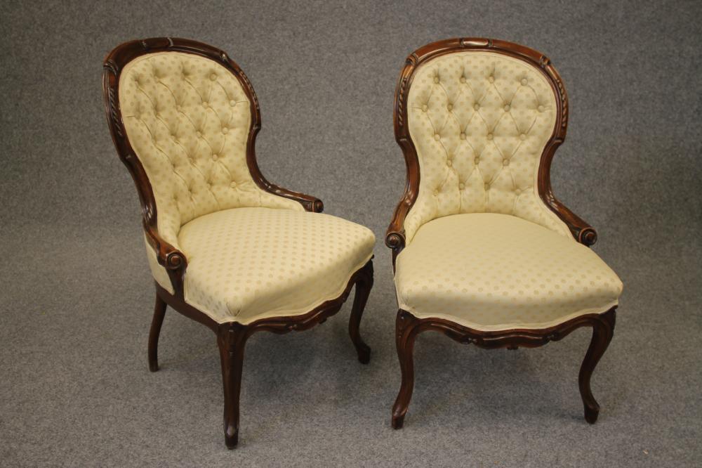 A PAIR OF VICTORIAN WALNUT FRAMED PARLOUR CHAIRS of spoonback form button upholstered in a cream Image
