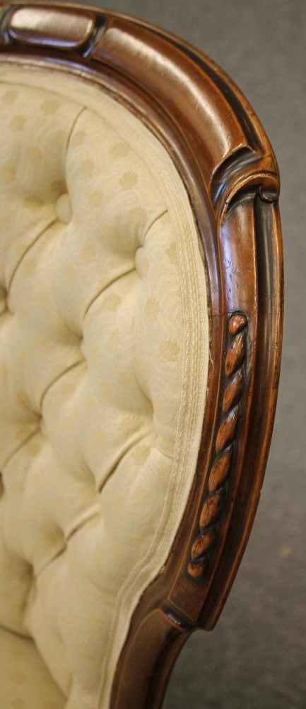 A PAIR OF VICTORIAN WALNUT FRAMED PARLOUR CHAIRS of spoonback form button upholstered in a cream Image