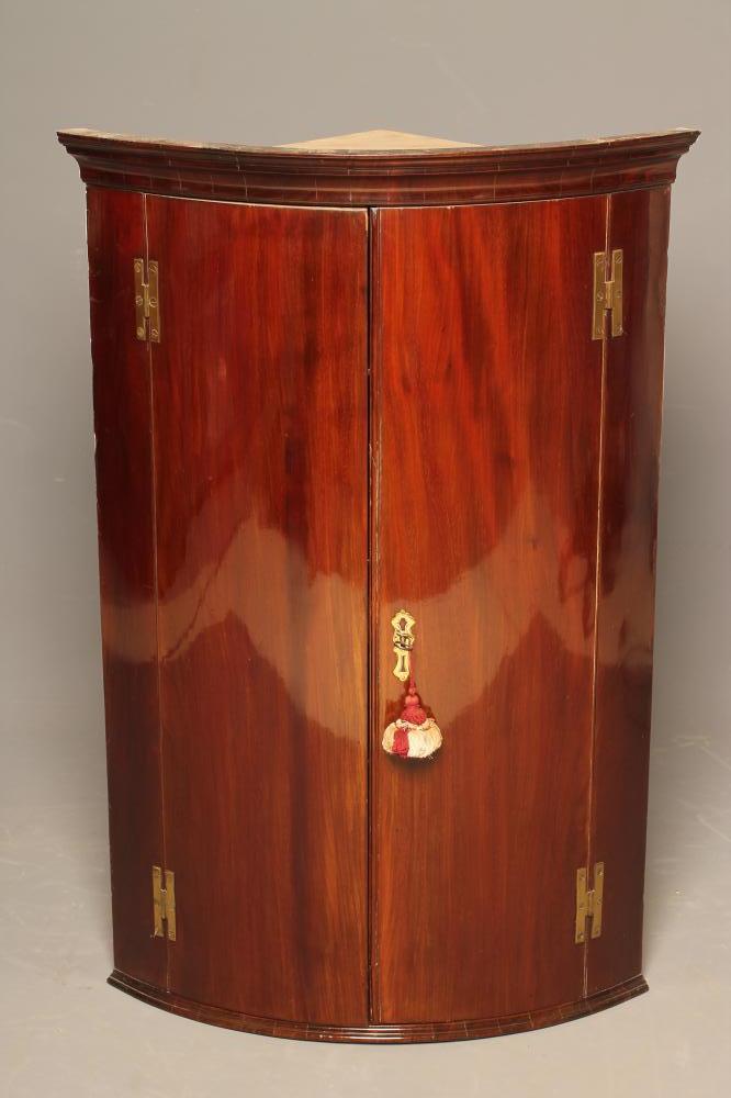 A GEORGIAN MAHOGANY QUADRANT CORNER CUPBOARD Image