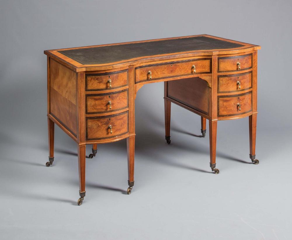 AN EDWARDIAN SATINWOOD DESK with stringing and ebony trim Image