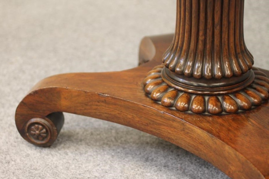A REGENCY ROSEWOOD FOLDING CARD TABLE of rounded oblong form Image