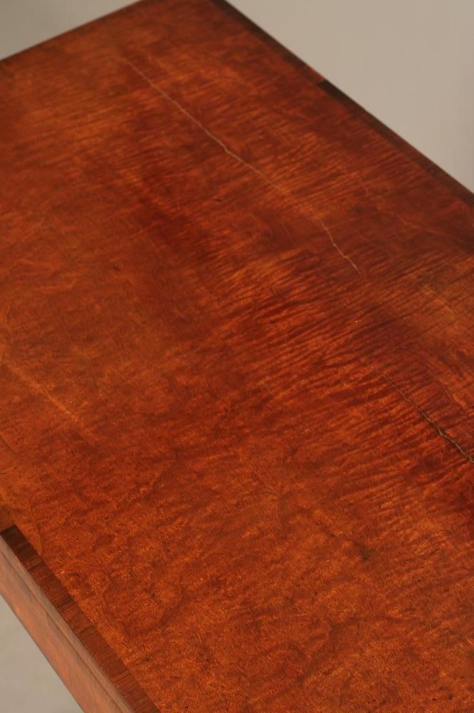 A REGENCY MAHOGANY FOLDING CARD TABLE of rounded oblong form with rosewood banding Image