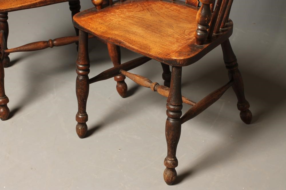 A MATCHED PAIR OF ASH AND ELM WINDSOR ARMCHAIRS Image