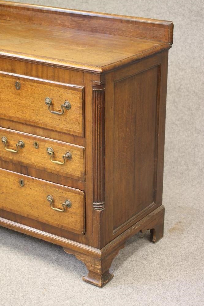 A GEORGIAN OAK AND MAHOGANY BANDED LANCASHIRE DRESSER Image