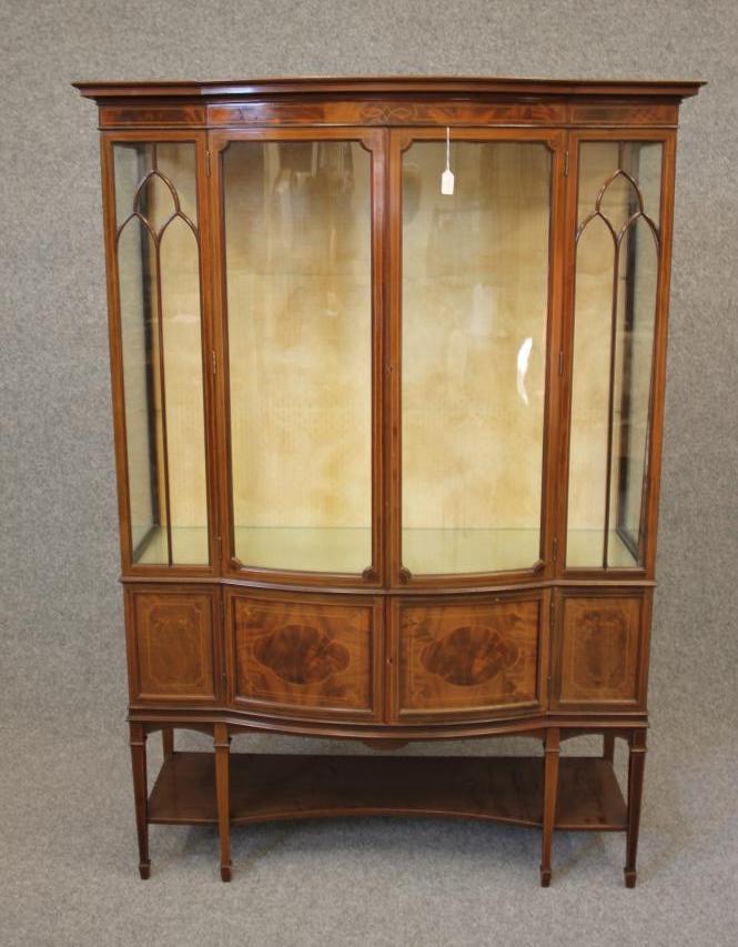 AN EDWARDIAN MAHOGANY DISPLAY CABINET of oblong form with stringing and chequer banding Image