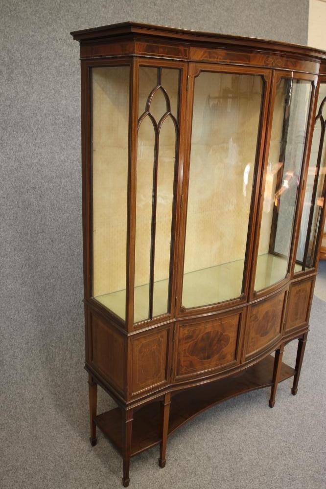 AN EDWARDIAN MAHOGANY DISPLAY CABINET of oblong form with stringing and chequer banding Image