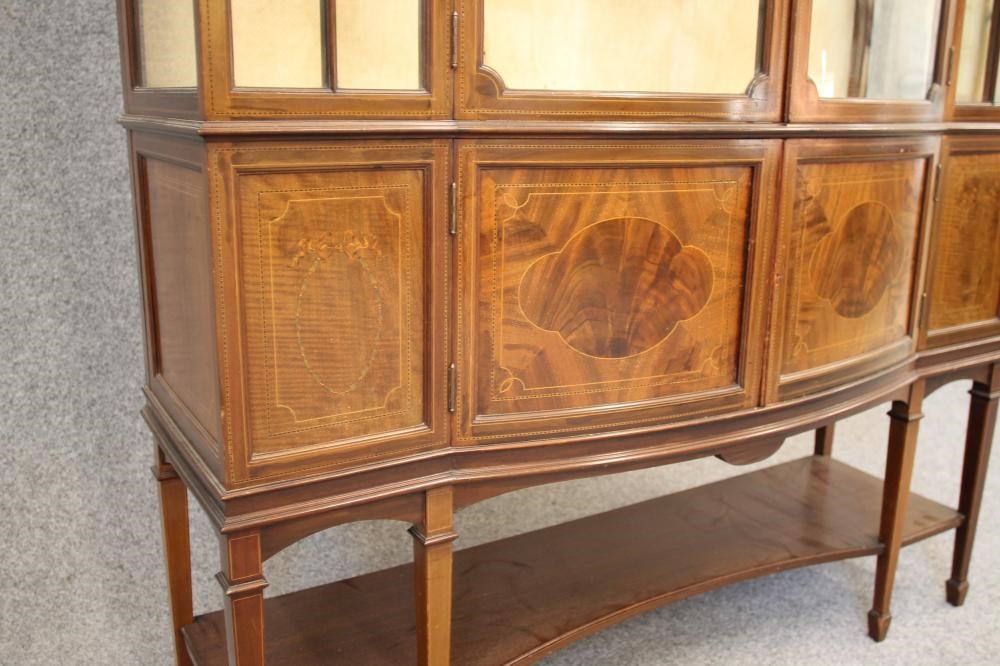 AN EDWARDIAN MAHOGANY DISPLAY CABINET of oblong form with stringing and chequer banding Image
