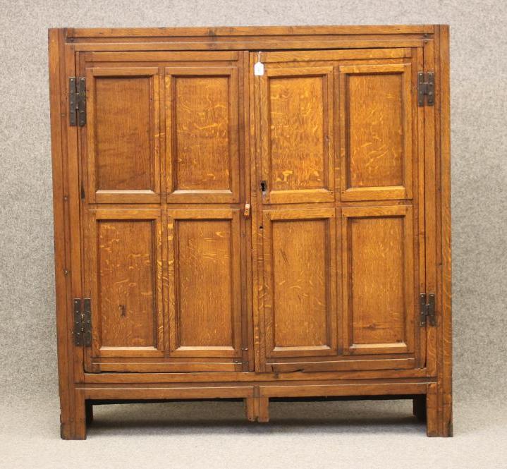 A JOINED OAK CUPBOARD Image
