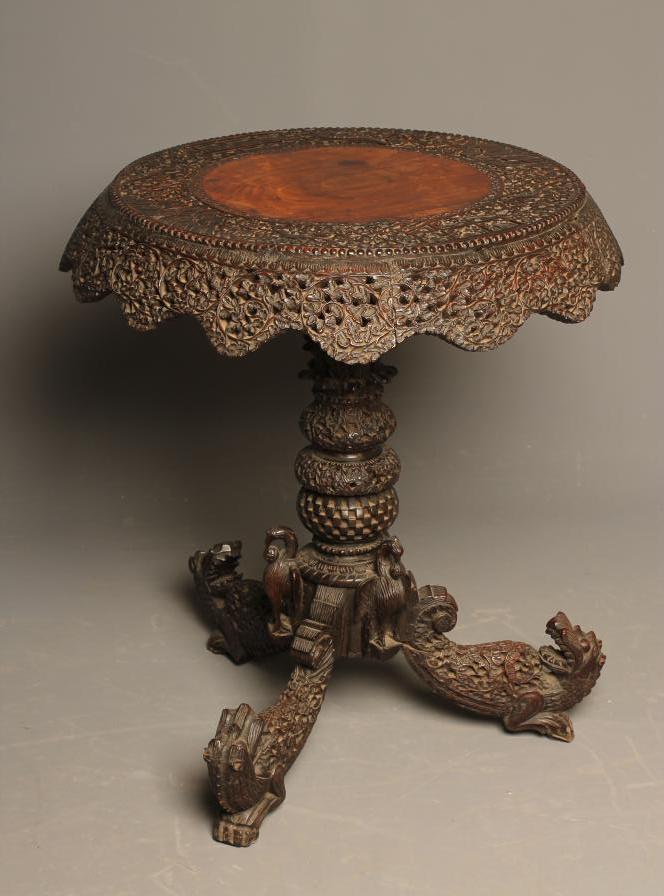 A BURMESE CARVED HARDWOOD OCCASIONAL TABLE Image