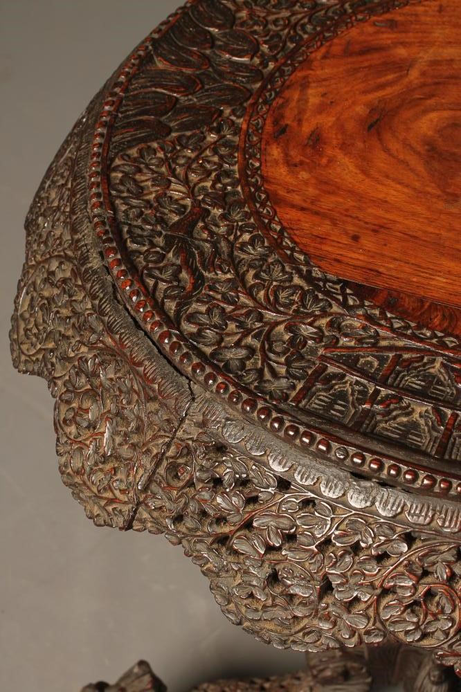 A BURMESE CARVED HARDWOOD OCCASIONAL TABLE Image