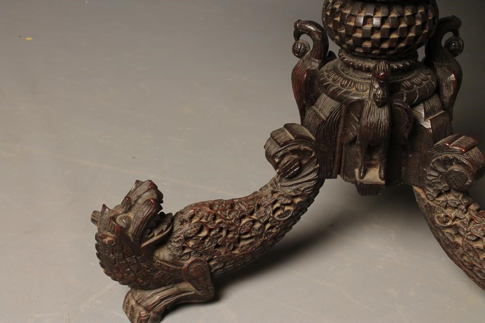 A BURMESE CARVED HARDWOOD OCCASIONAL TABLE Image