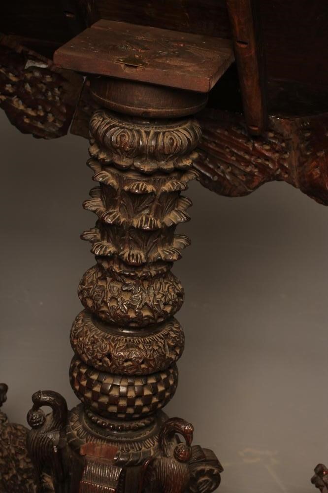 A BURMESE CARVED HARDWOOD OCCASIONAL TABLE Image