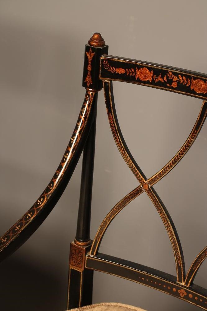 A SET OF FOUR REGENCY STYLE CANED AND PAINTED ELBOW CHAIR Image