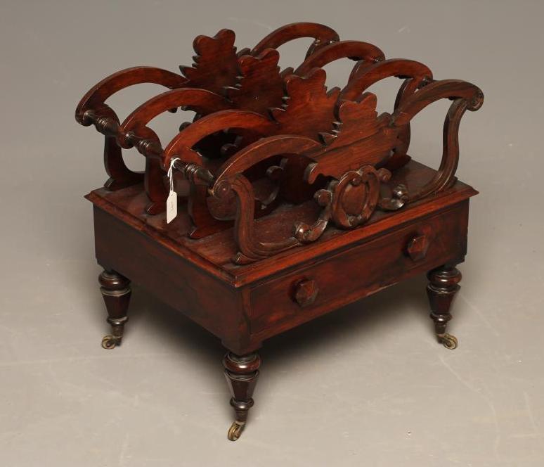 AN EARLY VICTORIAN ROSEWOOD CANTERBURY of oblong form applied with roundels Image