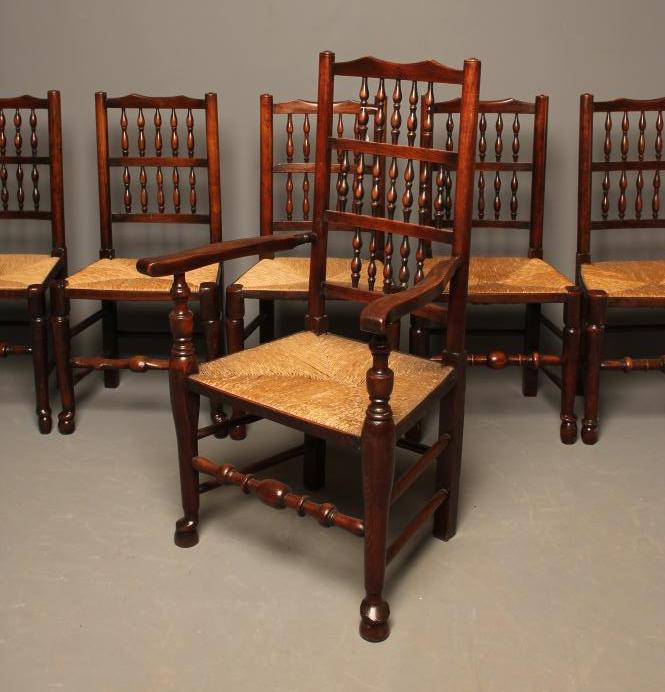 A MATCHED SET OF TEN ASH RUSH SEATED DINING CHAIRS Image