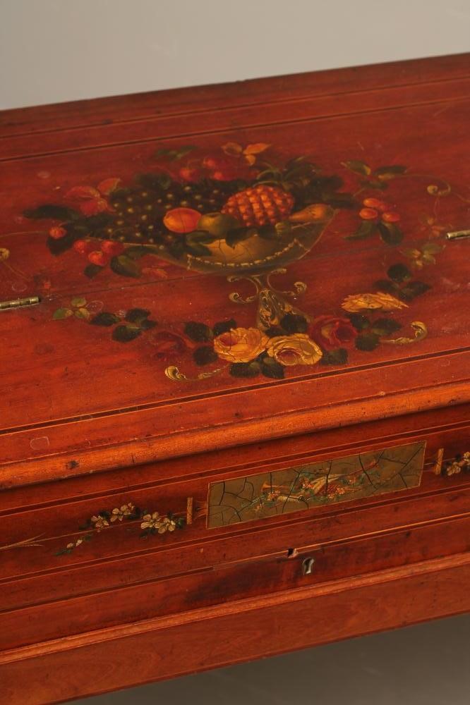 A LADY'S MAHOGANY DESK of oblong form painted with floral swags and musical trophies and with Image