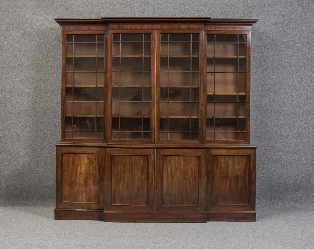 A GEORGIAN MAHOGANY BREAKFRONT BOOKCASE Image