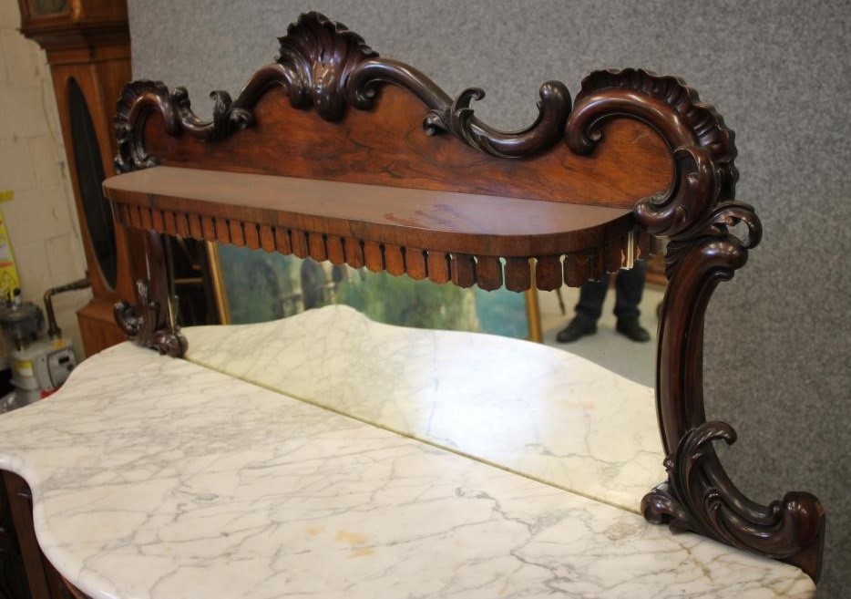 A VICTORIAN ROSEWOOD CREDENZA of serpentine form with white veined marble top Image