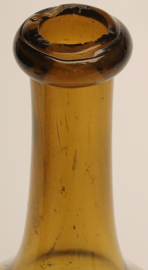 A LARGE GREEN GLASS BOTTLE Image