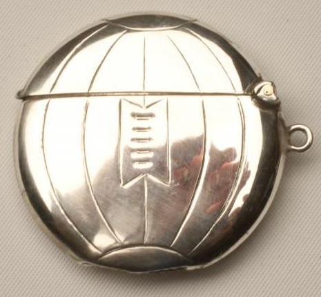 A SILVER NOVELTY FOOTBALL VESTA Image