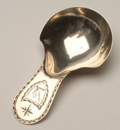 A GEORGE III SILVER CADDY SPOON Image