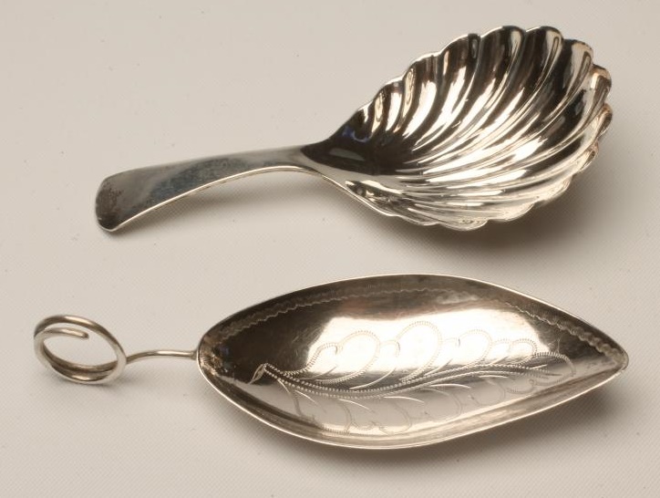 A LATE GEORGE III SILVER CADDY SPOON Image