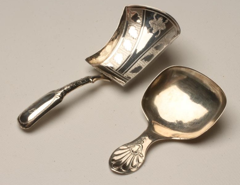 A LATE GEORGE III SILVER CADDY SPOON Image