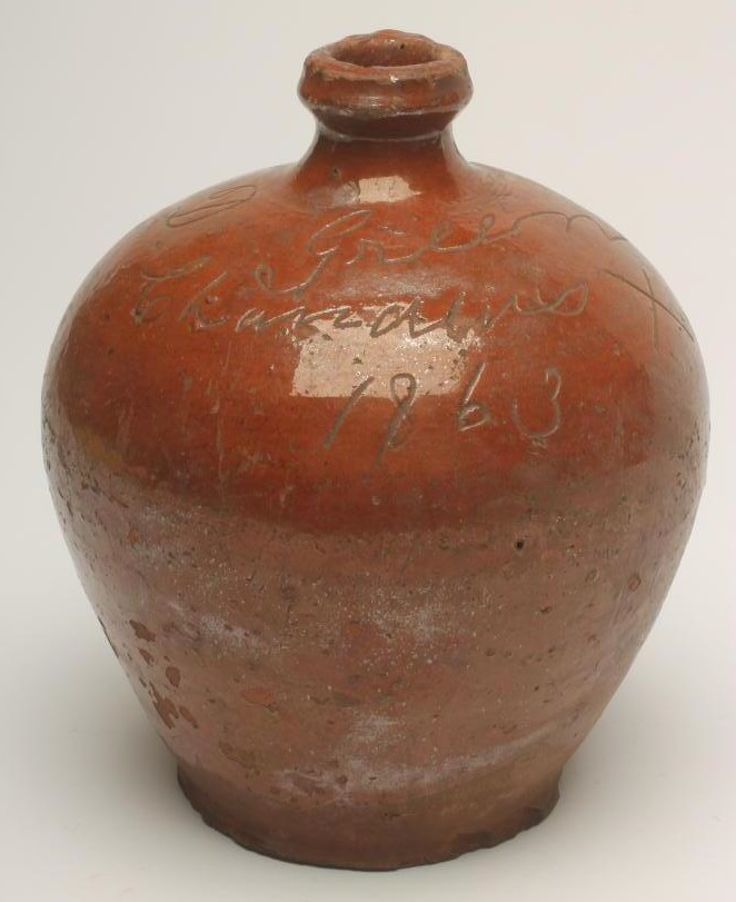 A VICTORIAN DOCUMENTARY GLAZED TERRACOTTA FLAGON Image
