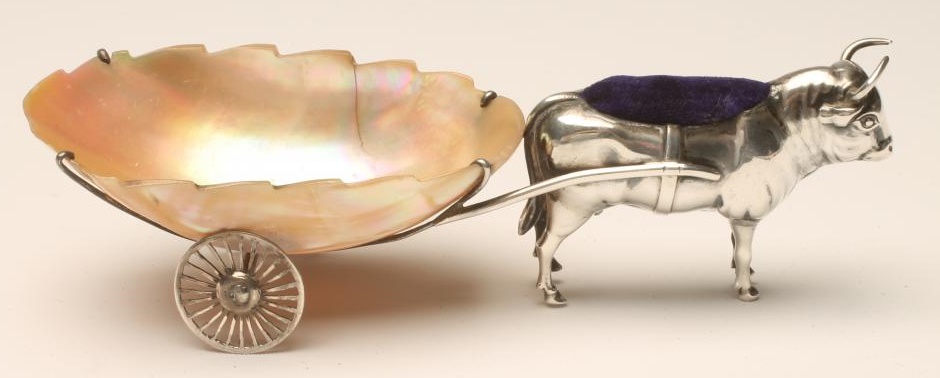 AN EDWARDIAN SILVER NOVELTY OX PIN CUSHION Image