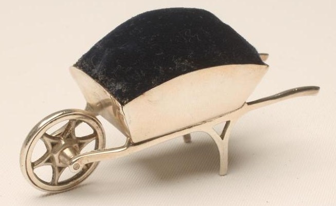 AN EDWARDIAN SILVER NOVELTY WHEELBARROW PIN CUSHION Image