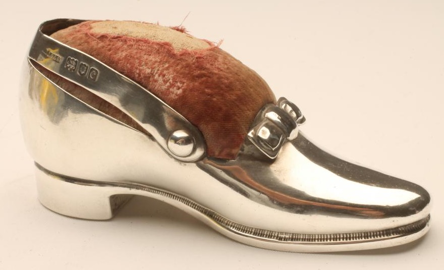 A LATE VICTORIAN LARGE SILVER NOVELTY SHOE PIN CUSHION Image