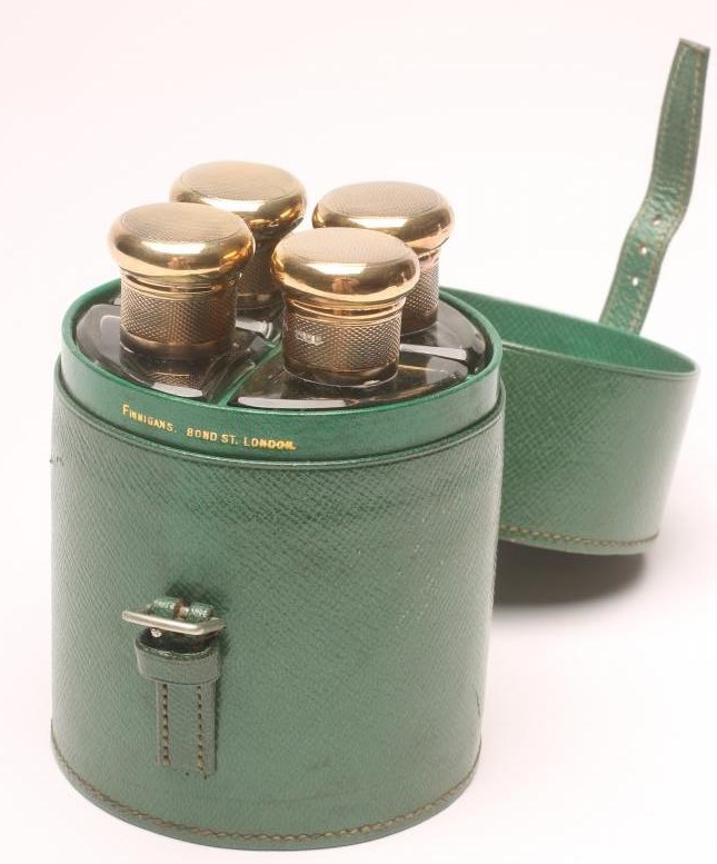 A TRAVELLING SILVER MOUNTED DRINKS SET Image