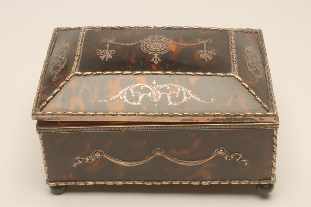 AN EDWARDIAN TORTOISESHELL AND SILVER JEWELLERY CASKET Image