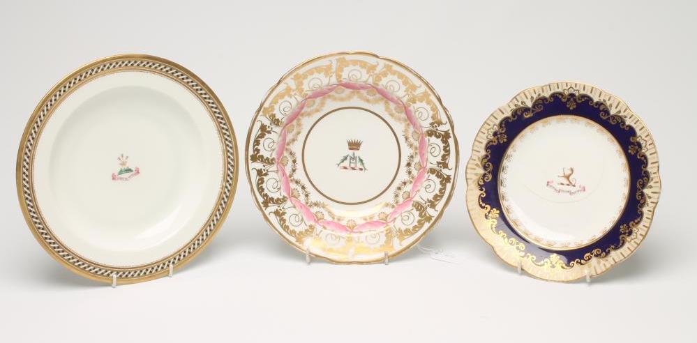 THREE ENGLISH PORCELAIN ARMORIAL DISHES comprising a Spode soup plate Image