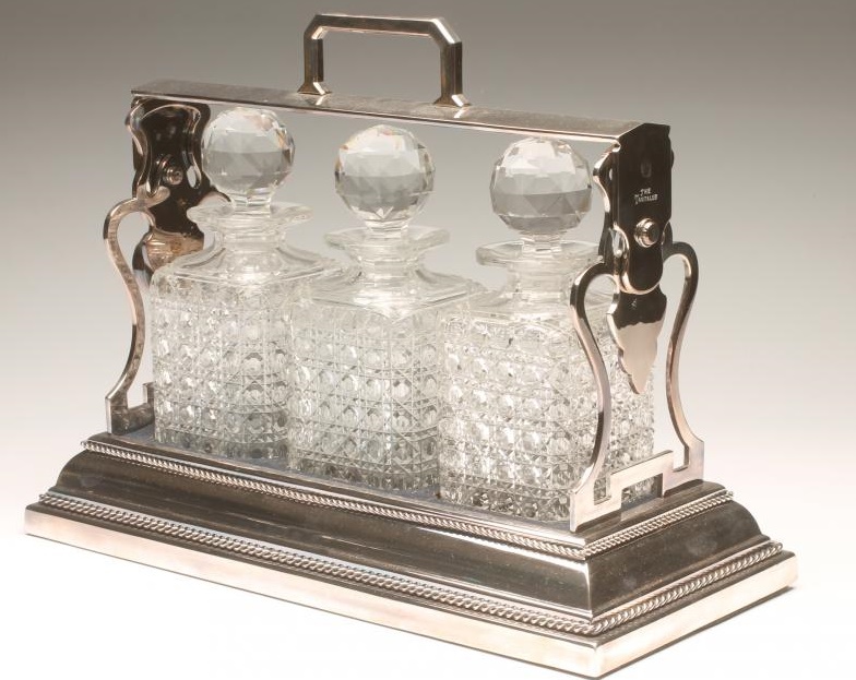 A SILVER PLATED BETJEMANN'S PATENT "THE TANTALUS" of oblong form with rope twist border Image