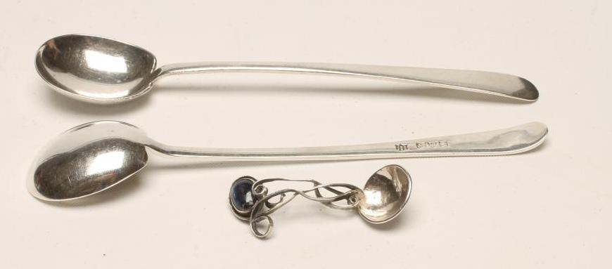 A COMPOSITE PAIR OF SILVER ARTS AND CRAFTS PRESERVE SPOONS Image