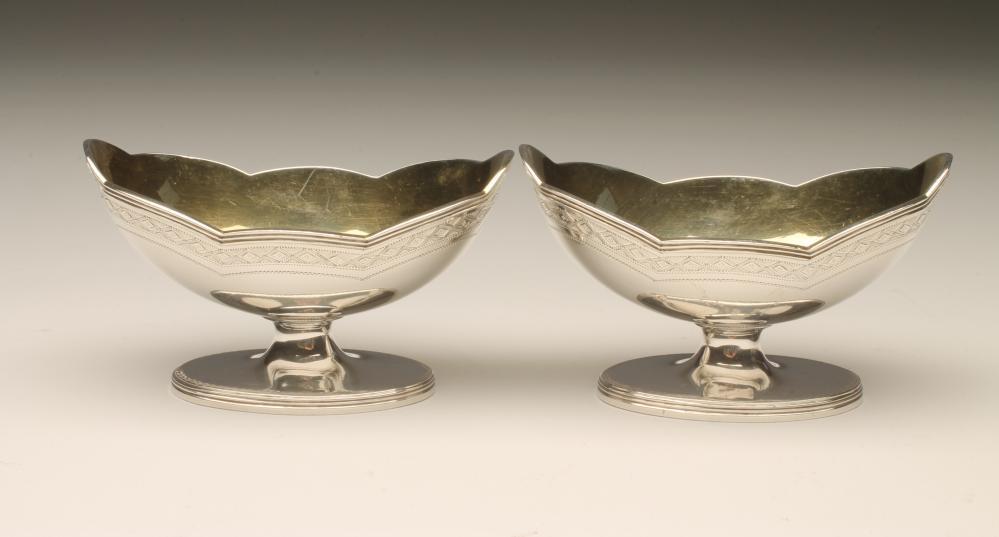 A PAIR OF GEORGE III SILVER PEDESTAL SALTS Image