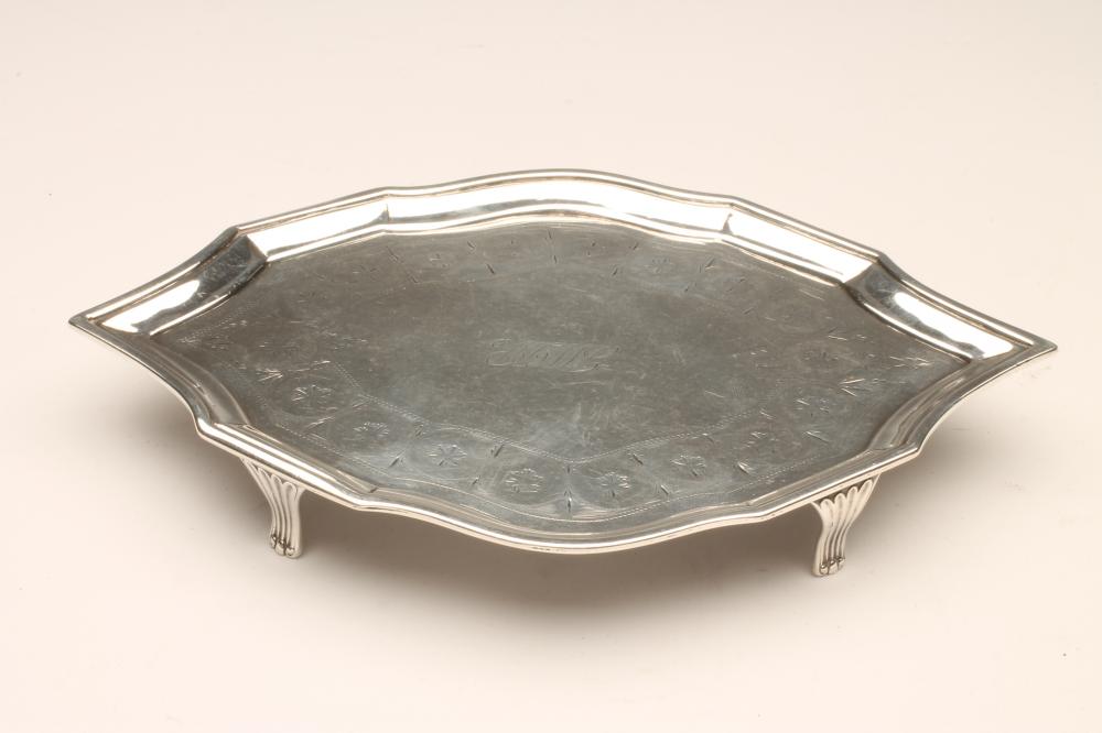 A LATE GEORGE III SILVER TEAPOT STAND Image