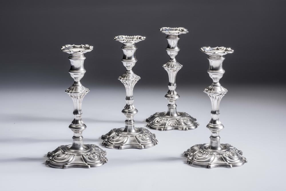 A SET OF FOUR GEORGE III SILVER CANDLESTICKS Image