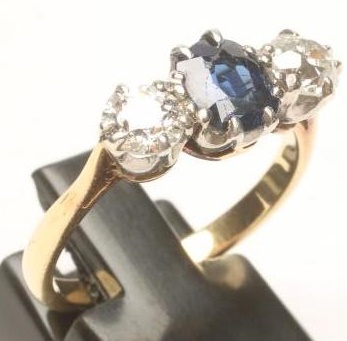 A SAPPHIRE AND DIAMOND THREE STONE RING Image