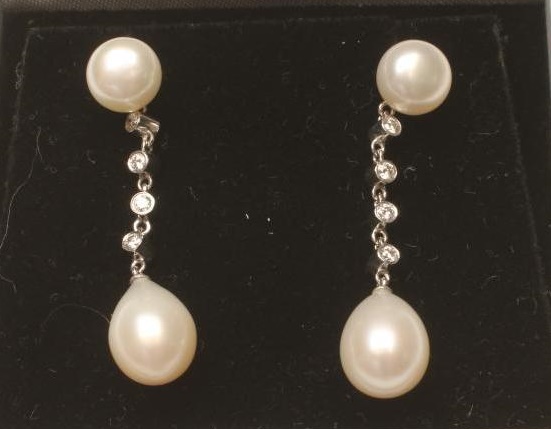 A PAIR OF PEARL AND DIAMOND DROP EAR STUDS Image
