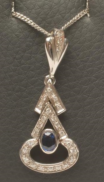 AN ART DECO STYLE SAPPHIRE AND DIAMOND PENDANT Image