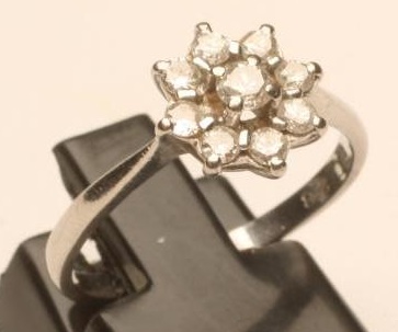 A NINE STONE DIAMOND CLUSTER RING Image