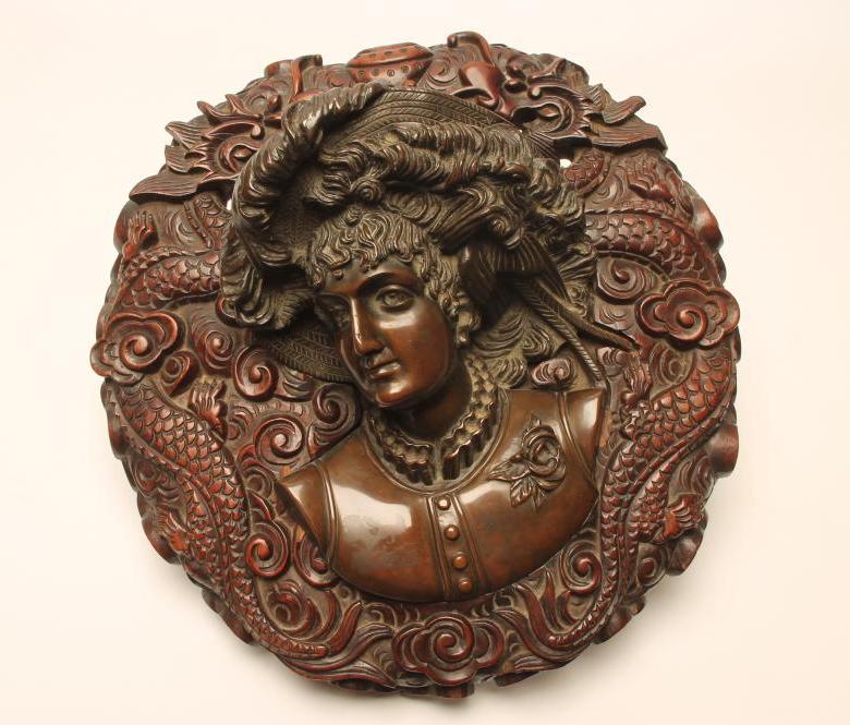 A BRONZE WALL PLAQUE Image