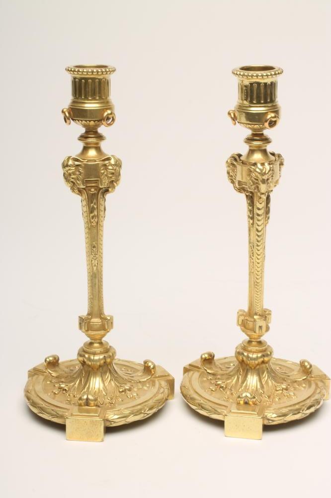 A PAIR OF FRENCH ORMOLU CANDLESTICKS stamped Maison Marnyhac Image