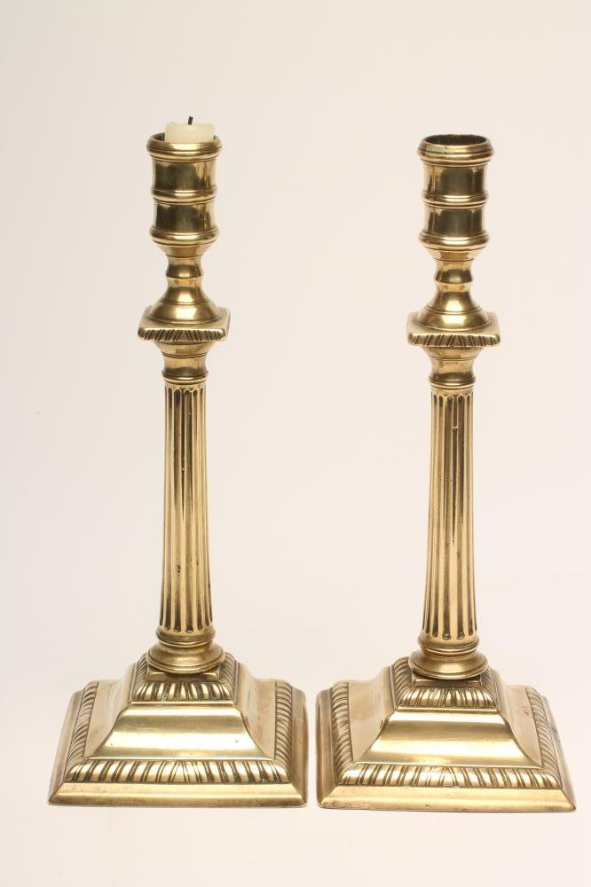A PAIR OF GEORGIAN BRASS SEAMED CANDLESTICKS Image