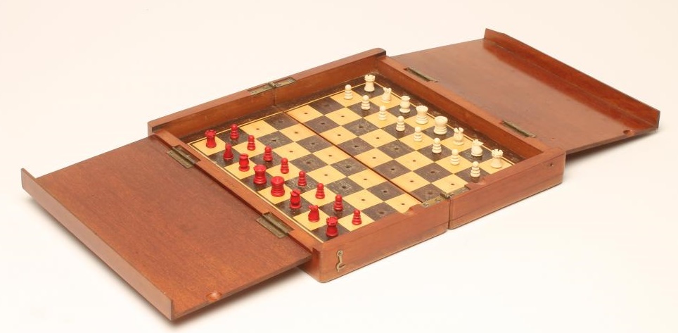 AN EDWARDIAN TRAVELLING CHESS SET by Jacques Image