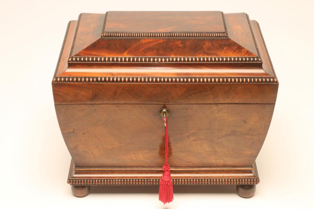 A REGENCY MAHOGANY DECANTER BOX of sarcophagus form with bead and reel edging Image